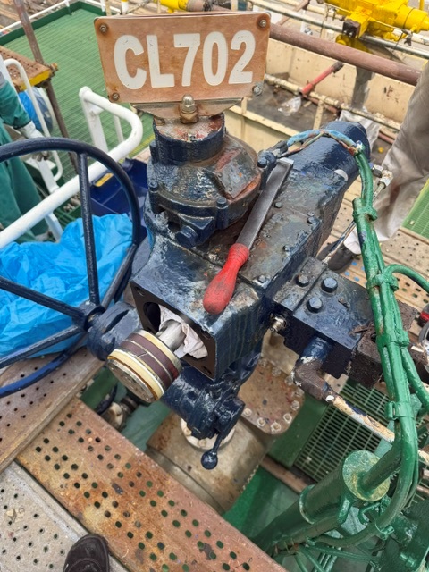Technician servicing an actuator on board