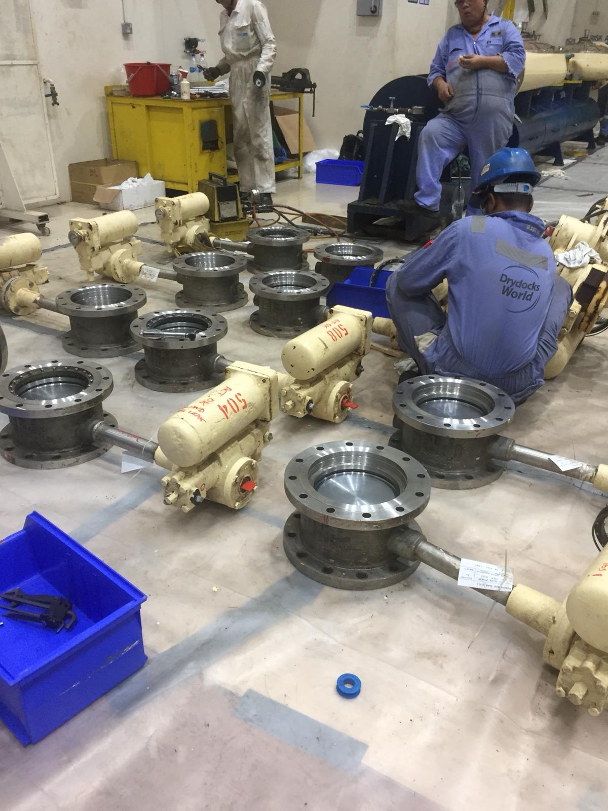 Royal Goodwin valves and actuators laid out for overhaul in the workshop